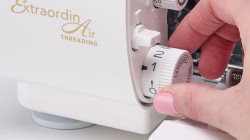 Image of DIAL ADJUSTABLE STITCH LENGTH AND AUTOMATIC ROLLED HEM